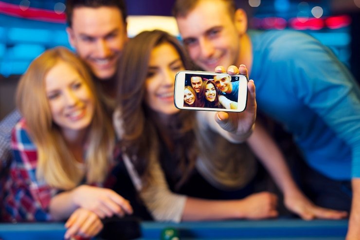 Filipino sports fans watching a live basketball game on mobile in Cebu